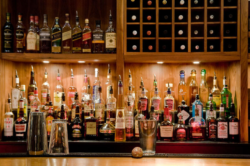 Back bar fully stocked with liquour